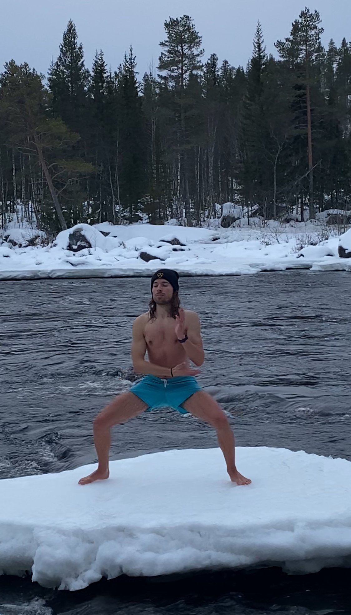 Filip practising movement beside a winter river
