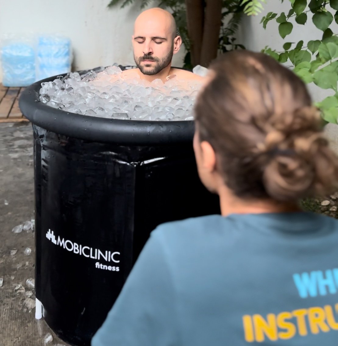 Filip guiding a participant through a cold-exposure workshop
